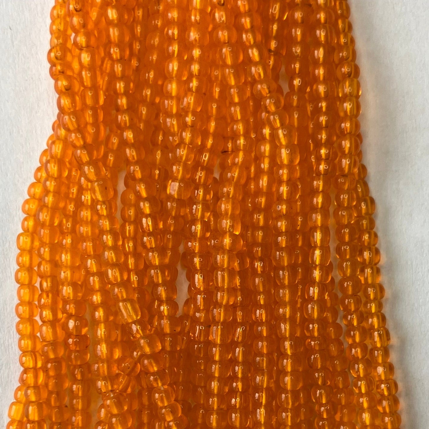 11/0 Transparent Orange Seed Beads – Hank